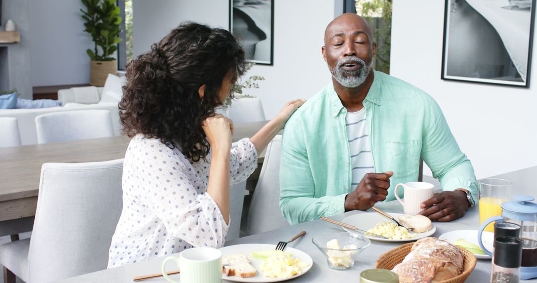 Couple Enjoying Breakfast and Conversation at Home