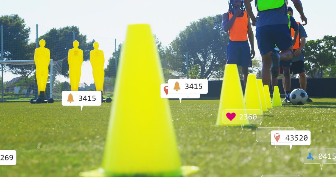 Bright yellow cone leading soccer drill on sunny training field with social media overlays