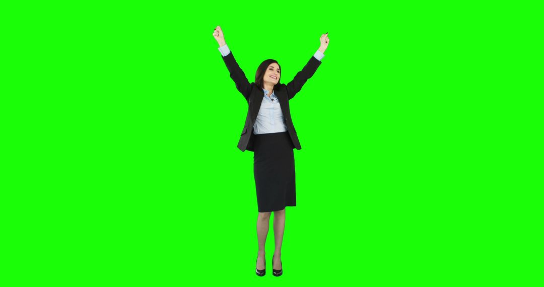 Excited Businesswoman Celebrating with Raised Arms on Green Screen - Free Images, Stock Photos and Pictures on Pikwizard.com