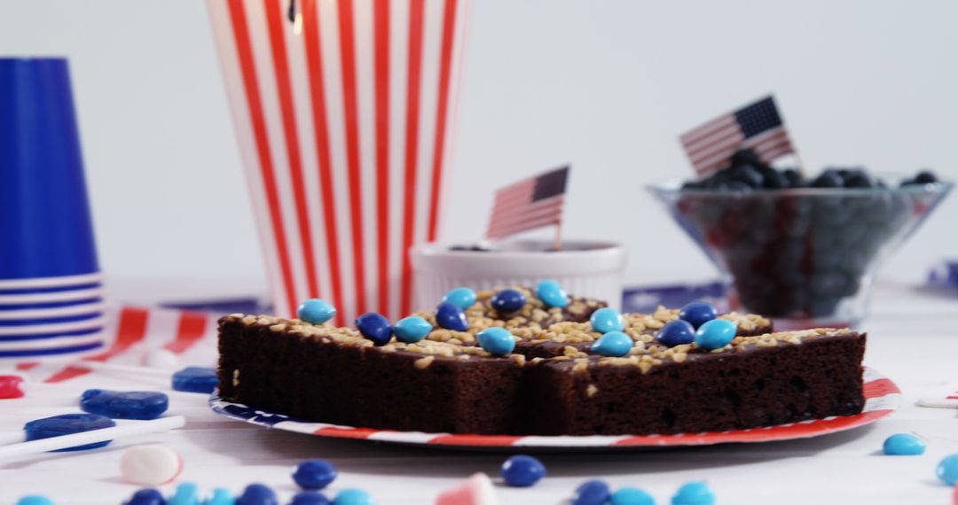 Patriotic Celebration Table with Chocolate Cake and American Flags - Free Images, Stock Photos and Pictures on Pikwizard.com