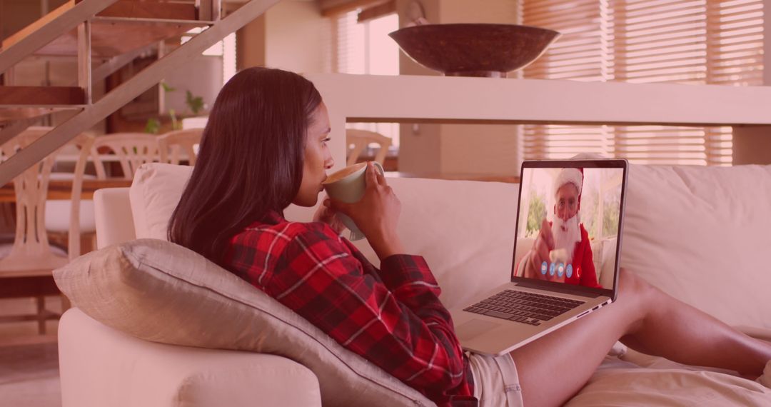 Young Woman Video Calling Santa Claus for Christmas Holiday Cheer