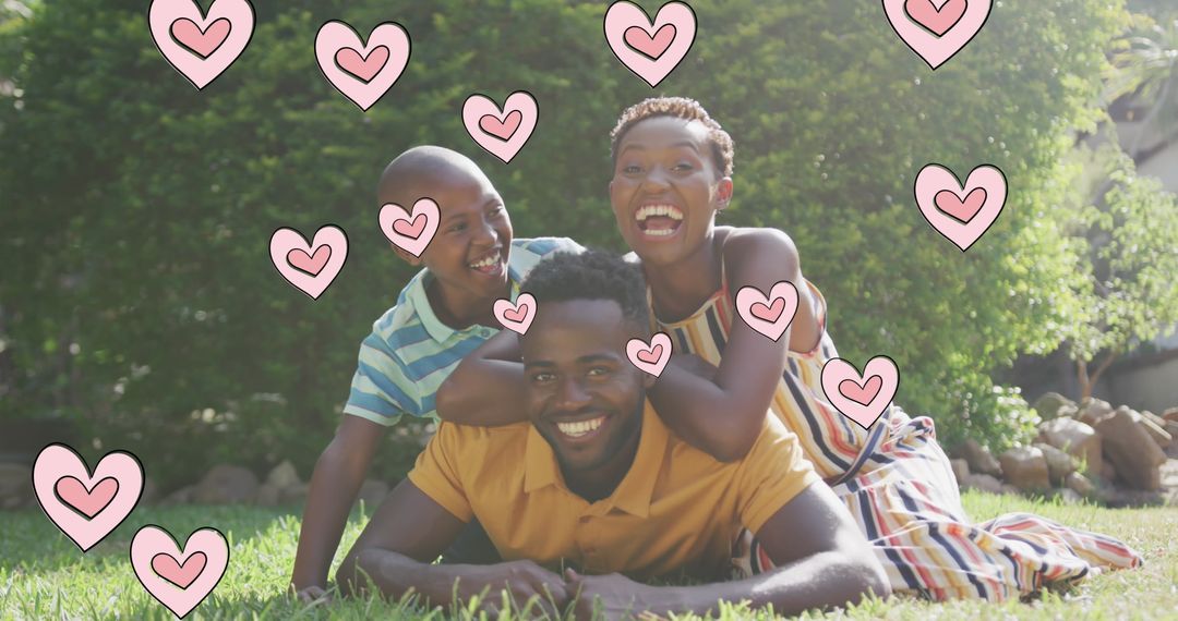 Smiling African American Family Relaxing in Garden with Love Hearts