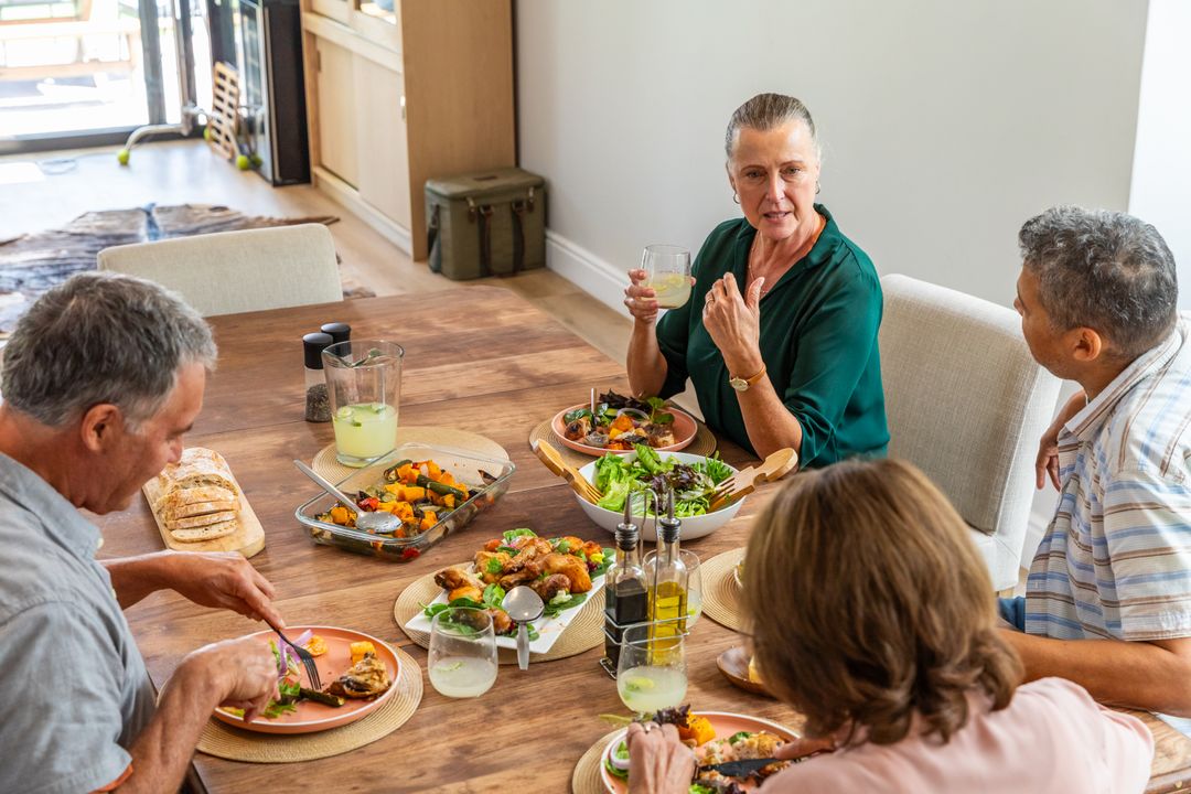 Diverse Seniors Enjoying Homestyle Lunch and Meaningful Conversation
