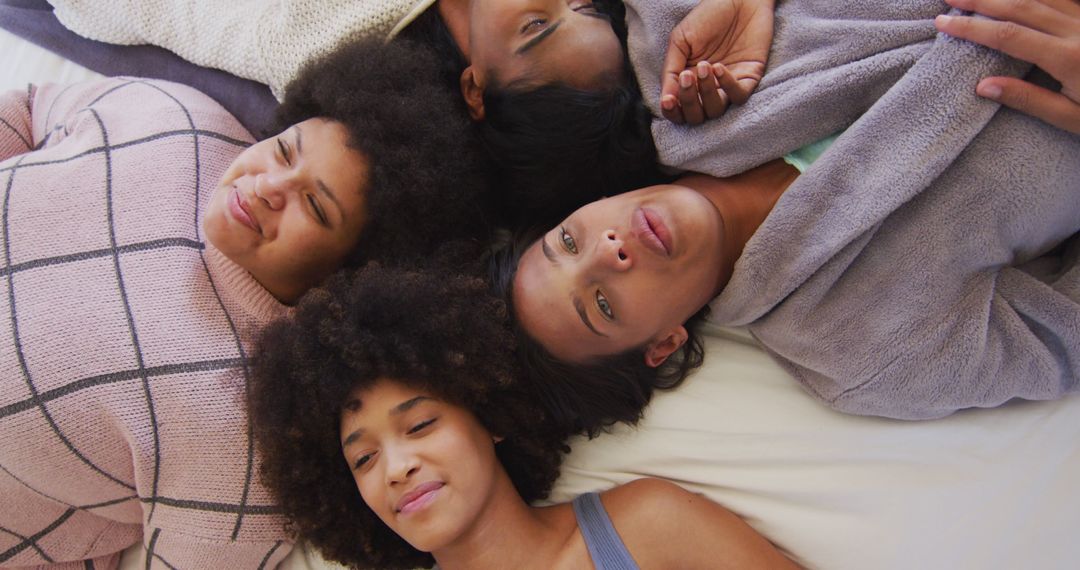 Group of African American Women Relaxing Together in Morning Bed - Free Images, Stock Photos and Pictures on Pikwizard.com