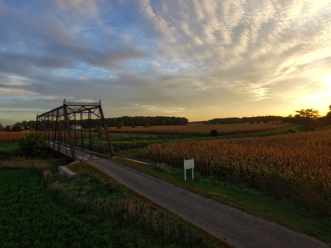 View of Farm Field and Bridge during Sunset - Free Images, Stock Photos and Pictures on Pikwizard.com