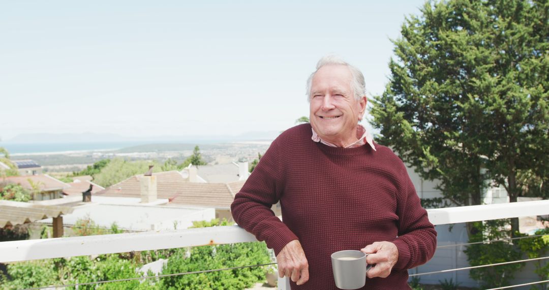 Smiling Elderly Man Enjoying Morning Coffee on Balcony - Free Images, Stock Photos and Pictures on Pikwizard.com