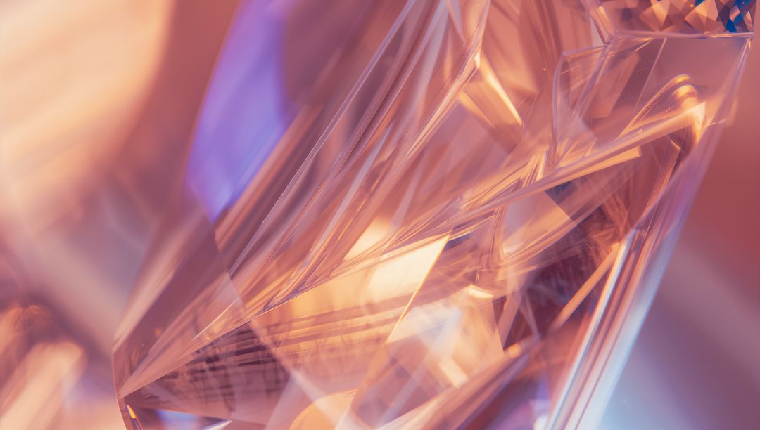 Glittering faceted crystal refracting peach lavender light for abstract luxury backdrop