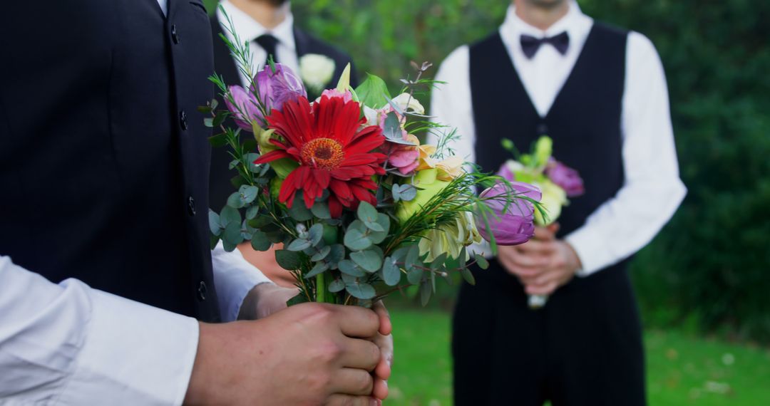 Groom and Groomsmen Holding Colorful Bouquets at Outdoor Wedding - Free Images, Stock Photos and Pictures on Pikwizard.com