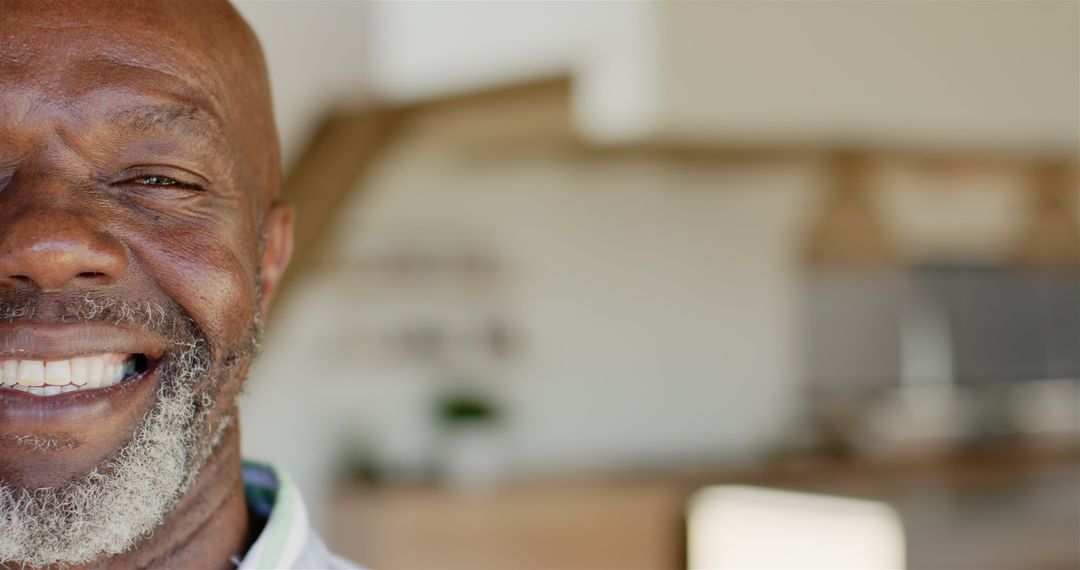 Joyful Mature Man with Infectious Smile Relaxing at Home