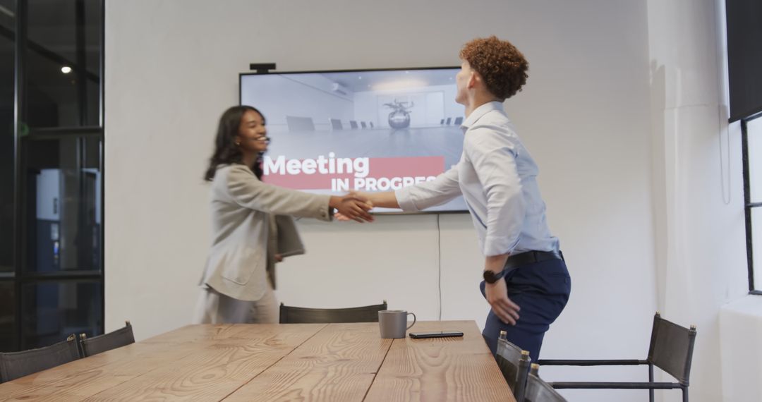 Diverse Professionals Discussing Projects at Office