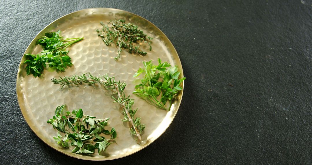 Assorted Fresh Culinary Herbs on Textured Golden Plate - Free Images, Stock Photos and Pictures on Pikwizard.com