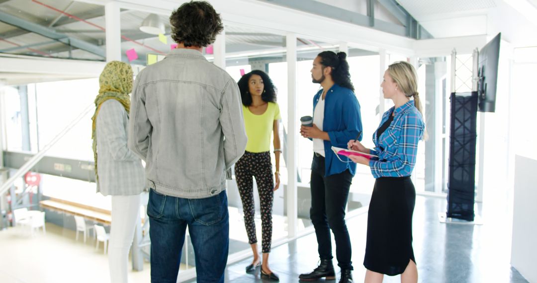 Diverse Team Collaborating in Modern Office Interiors