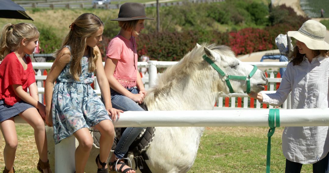 Children Enjoying Horseback Riding at Outdoor Ranch - Free Images, Stock Photos and Pictures on Pikwizard.com