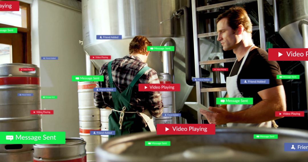 Brewery Workers Connecting through Technology in Industrial Setting