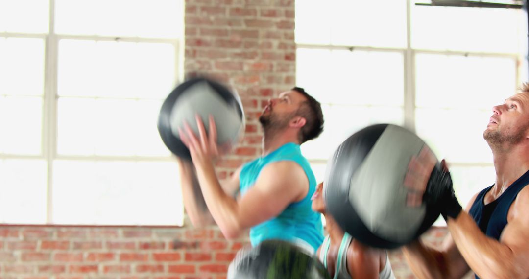 Group of People Exercising with Medicine Balls in Gym - Free Images, Stock Photos and Pictures on Pikwizard.com