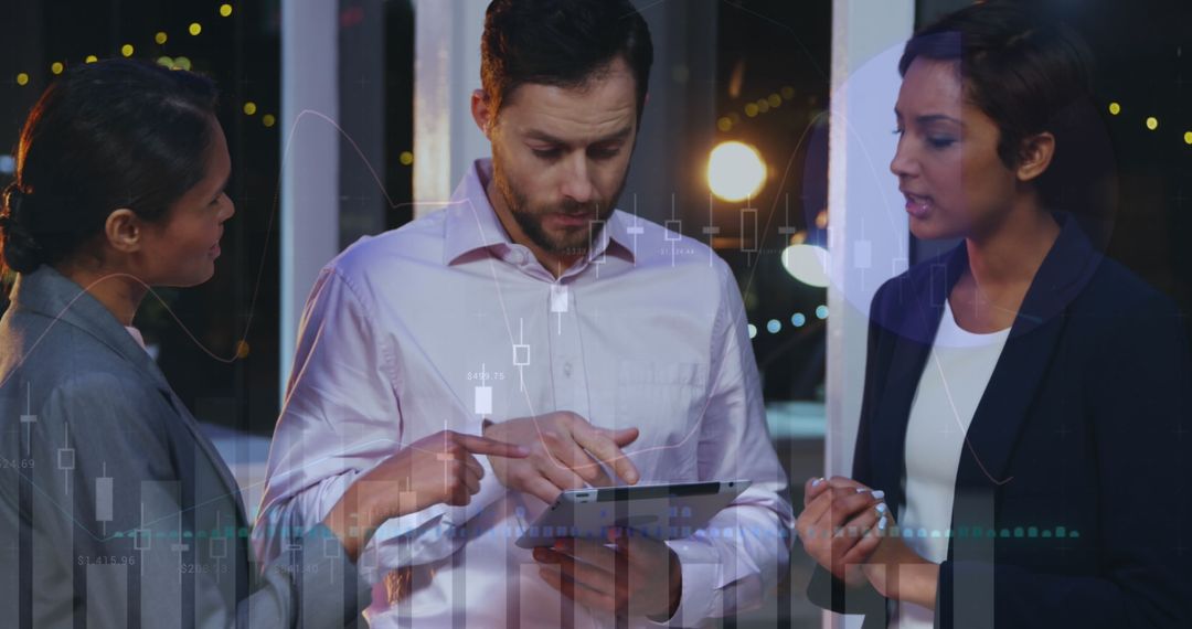 Team Collaborating on Digital Reports in Modern Office at Night