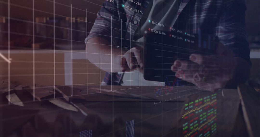 Business Professional Analyzing Stock Data on Tablet with Graph Overlay
