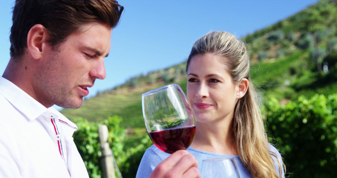 Couple Enjoying Wine Tasting in Scenic Vineyard