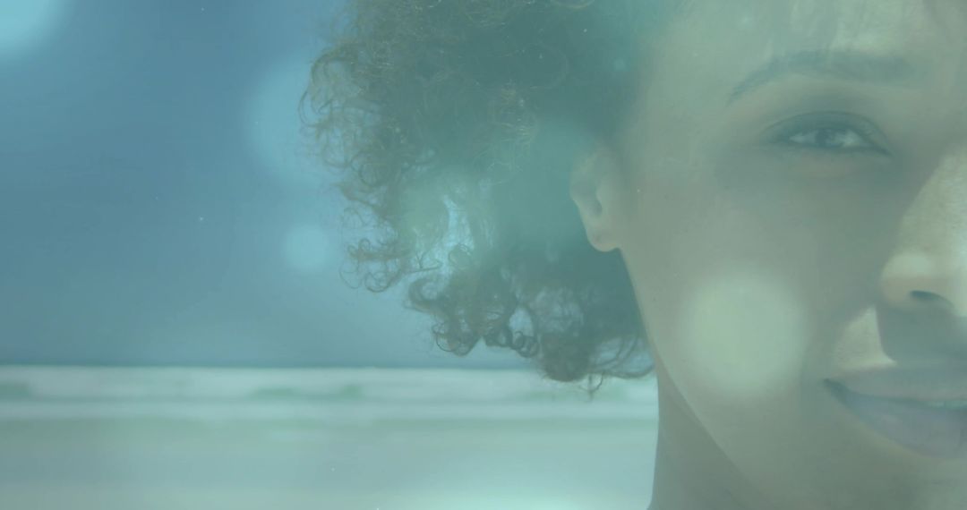 Glistening Portrait of Woman on Tranquil Beach with Bokeh