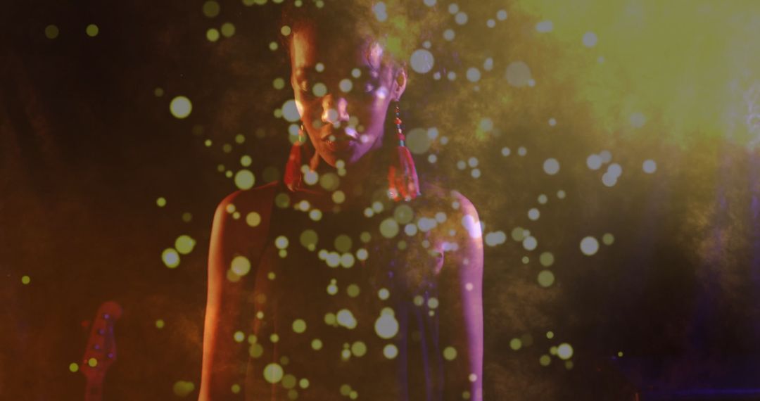 Silhouetted Performer Amidst Mystical Smoke and Bokeh Lights