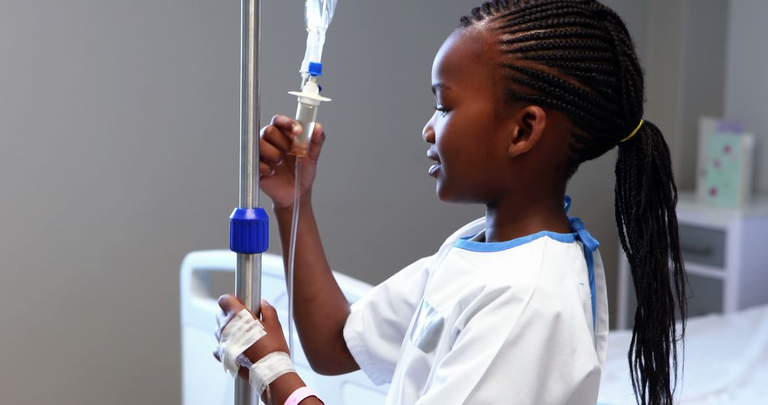 Young African American Girl in Hospital with IV Drip in Hand - Free Images, Stock Photos and Pictures on Pikwizard.com