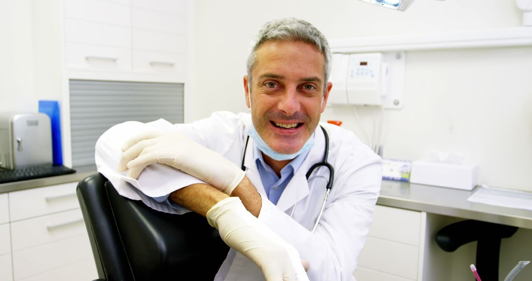 Friendly Dentist in Clinic with Gloves and Stethoscope - Free Images, Stock Photos and Pictures on Pikwizard.com