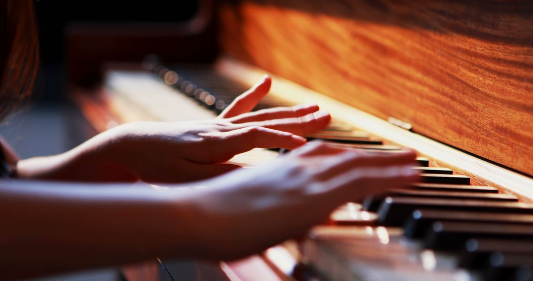 Close-Up of Hands Gracefully Playing Piano