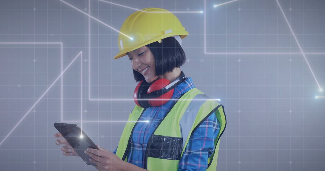 Female Engineer Inspecting Blueprints on Tablet Wearing Hard Hat and Safety Vest - Free Images, Stock Photos and Pictures on Pikwizard.com