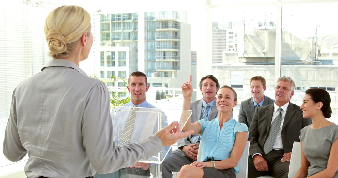 Businesswoman Leading Training Session for Diverse Team in Modern Office - Free Images, Stock Photos and Pictures on Pikwizard.com