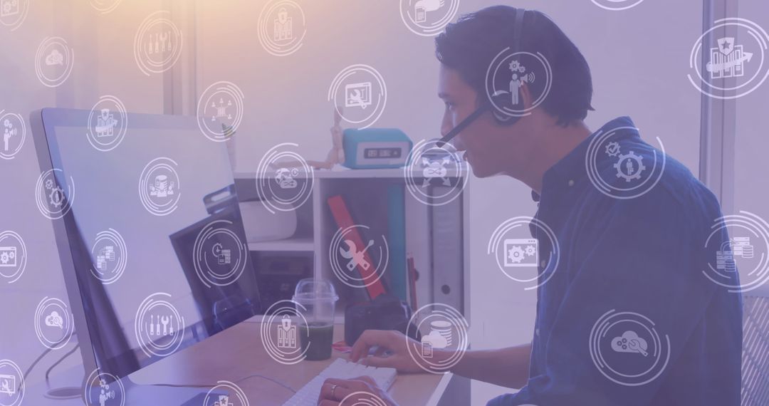 Businessman in Office Using Computer and Headset with Digital Icons Overlay