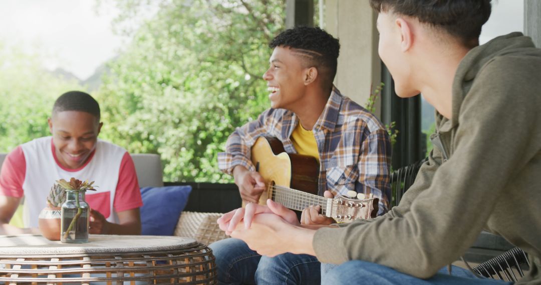 Teenagers Enjoying Outdoor Guitar Music and Conversations - Free Images, Stock Photos and Pictures on Pikwizard.com