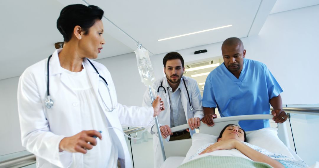 Medical Team Moving Patient on Hospital Stretcher - Free Images, Stock Photos and Pictures on Pikwizard.com