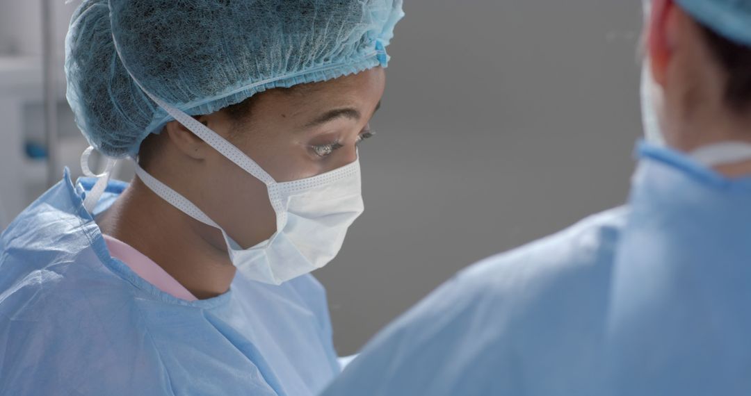 Surgeons in Operating Room Wearing Surgical Masks and Scrubs - Free Images, Stock Photos and Pictures on Pikwizard.com