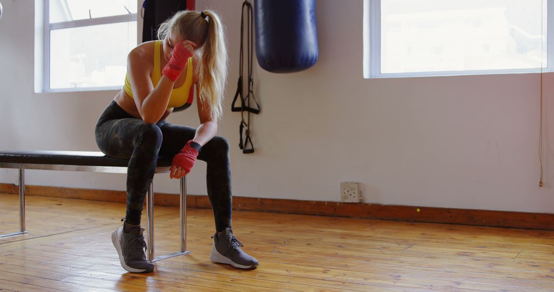 Exhausted Female Boxer Resting in Gym - Free Images, Stock Photos and Pictures on Pikwizard.com