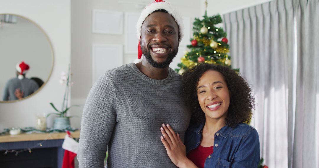 Happy African American Couple Celebrating Christmas at Home - Free Images, Stock Photos and Pictures on Pikwizard.com