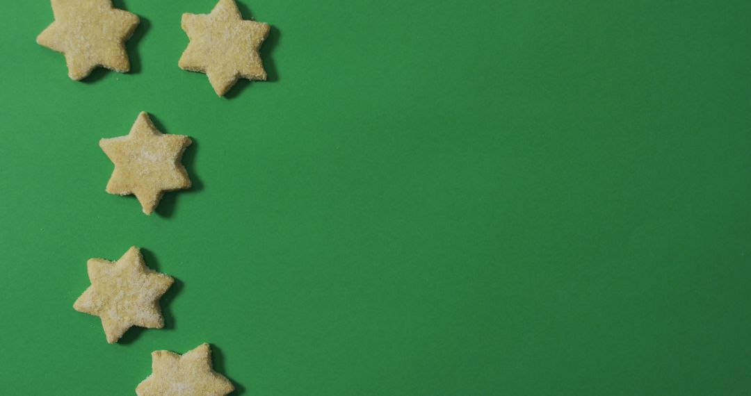 Star shaped christmas cookies and copy space on green background - Free Images, Stock Photos and Pictures on Pikwizard.com