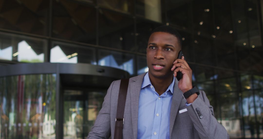 Confident African American Businessman Discussing Work on Smartphone