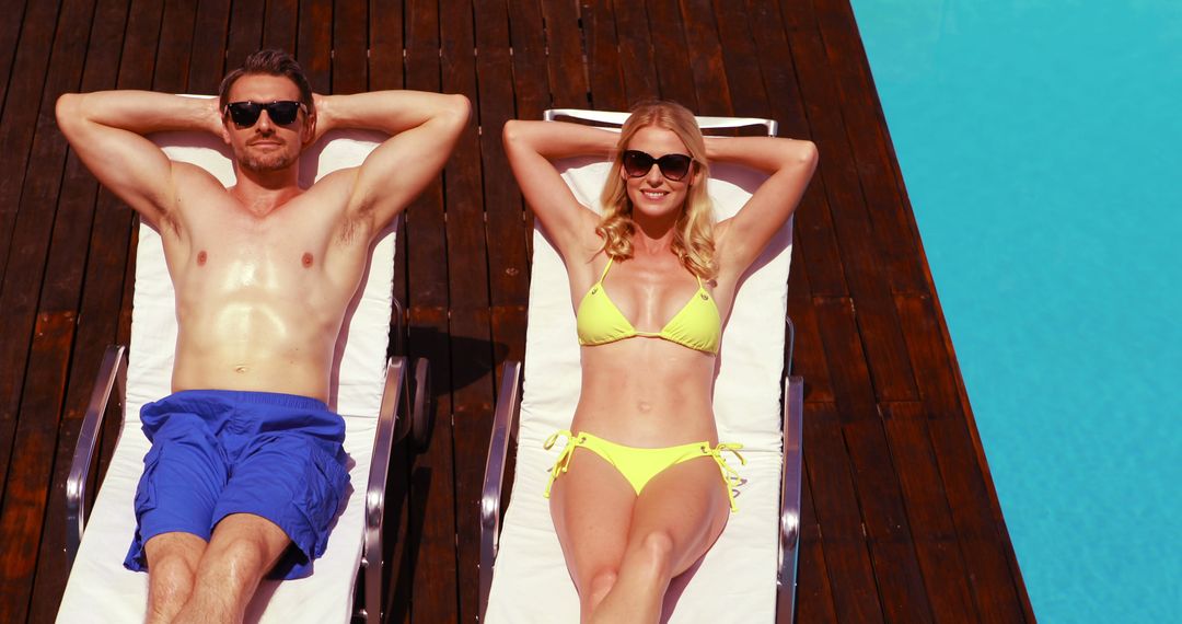 Couple Relaxing by Poolside in Summer Sunlight - Free Images, Stock Photos and Pictures on Pikwizard.com