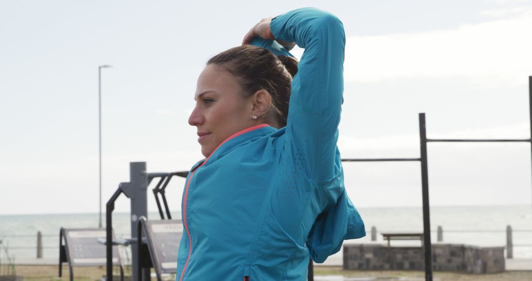 Woman Stretching Outdoors by the Beach - Free Images, Stock Photos and Pictures on Pikwizard.com