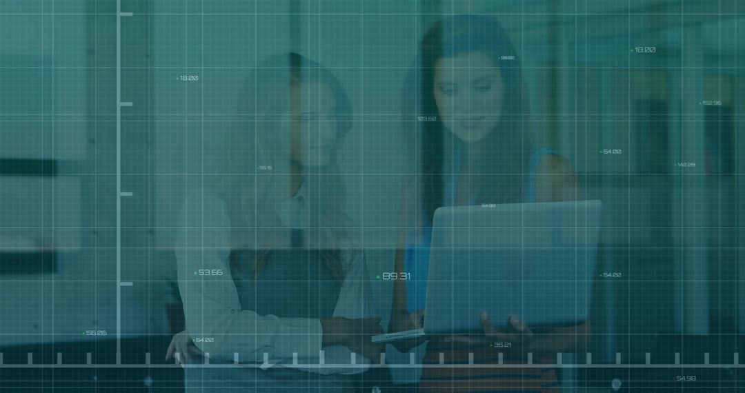 Female Business Professionals Analyzing Financial Data During Meeting