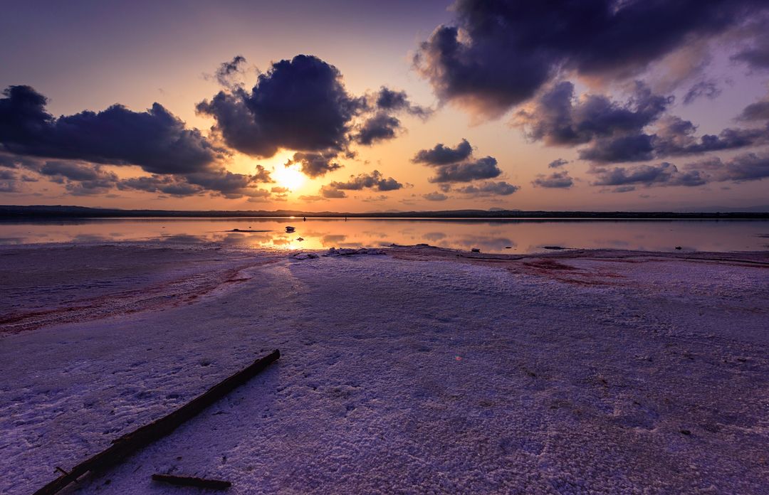 Stunning Sunset Over Salt Flat with Colorful Sky and Clouds - Free Images, Stock Photos and Pictures on Pikwizard.com