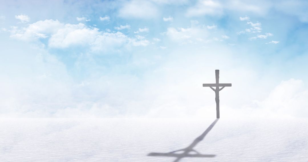 Silhouette of Cross Casting Long Shadow on Cloudy Sky