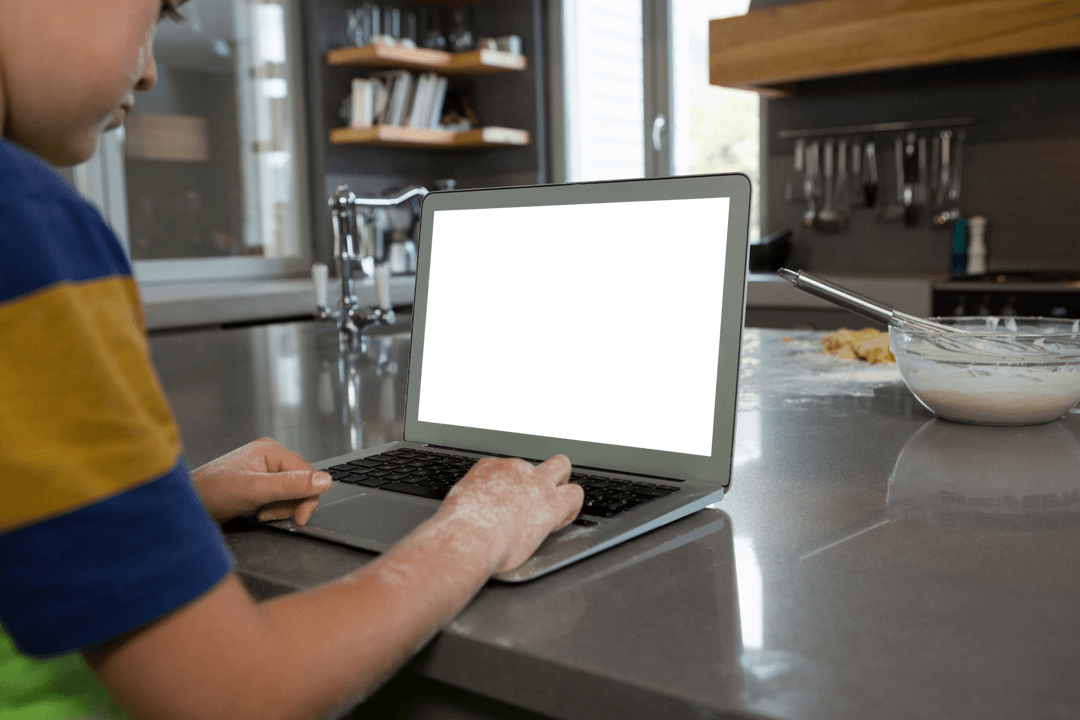 Child Using Laptop on Kitchen Counter with Transparent Screen