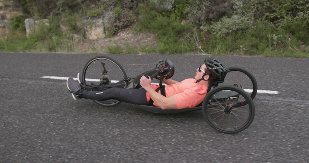 Man Riding Recumbent Handcycle on Rural Road - Free Images, Stock Photos and Pictures on Pikwizard.com