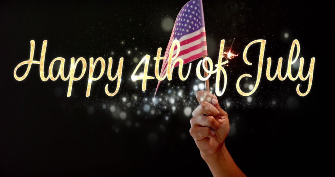 Hand Holding USA Flag with Sparkling 4th of July Text