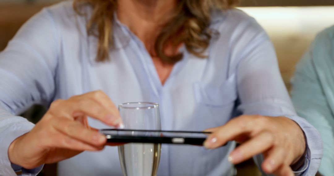 Person Taking Photo of Glassware with Smartphone - Free Images, Stock Photos and Pictures on Pikwizard.com