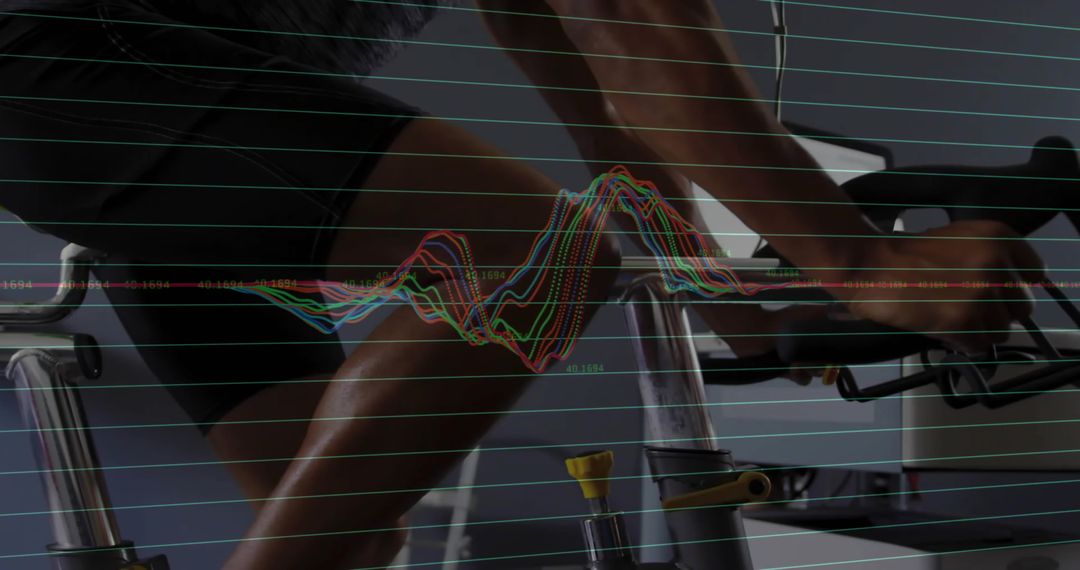 Athlete Analyzing Cycling Performance with Data Visualization in Fitness Lab