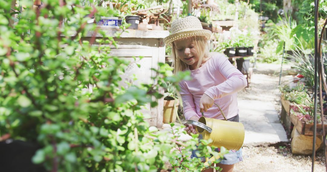 Young Girl Watering Plants in Garden on Sunny Day - Free Images, Stock Photos and Pictures on Pikwizard.com