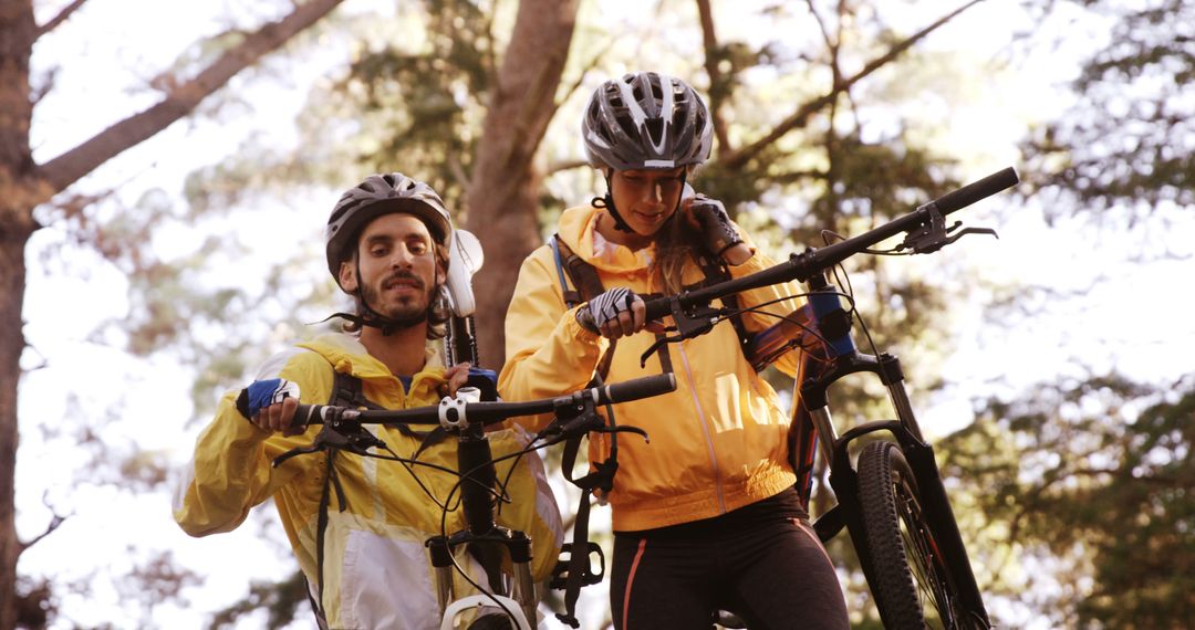 Enthusiastic Cyclists Exploring Forest with Mountain Bikes