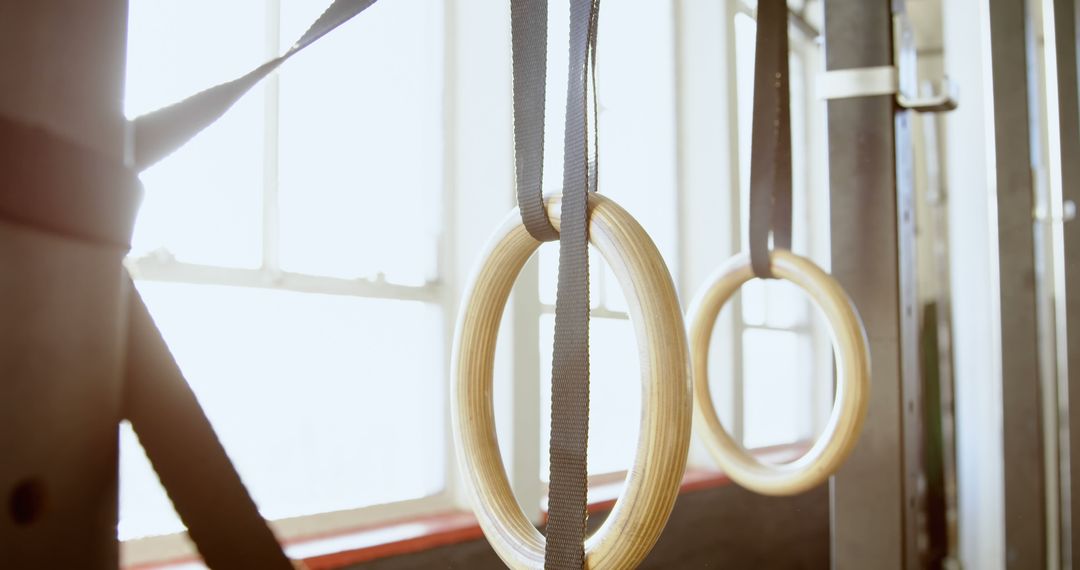 Close Up of Gymnastics Rings Hanging in Gym - Free Images, Stock Photos and Pictures on Pikwizard.com